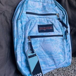 Jansport backpack, blue and clouds.